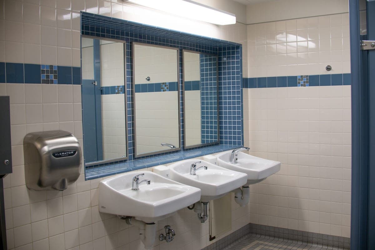 Twin white basins in a bright bathroom